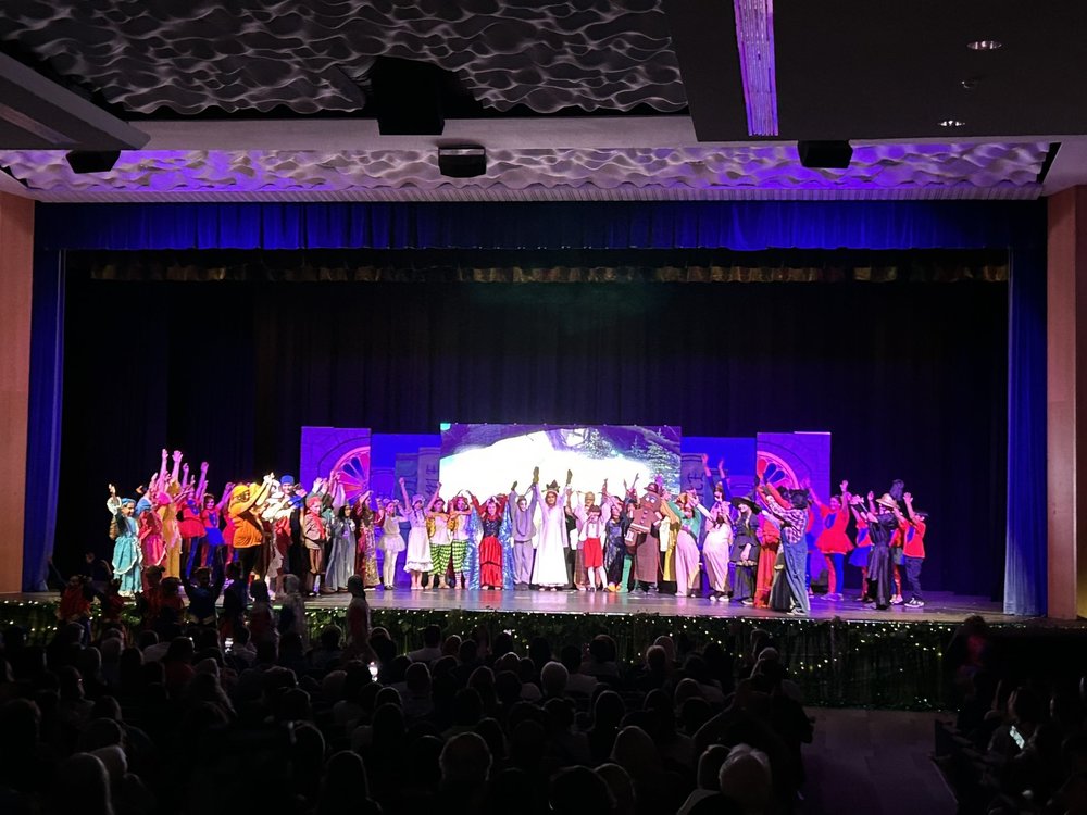 Students on stage during show